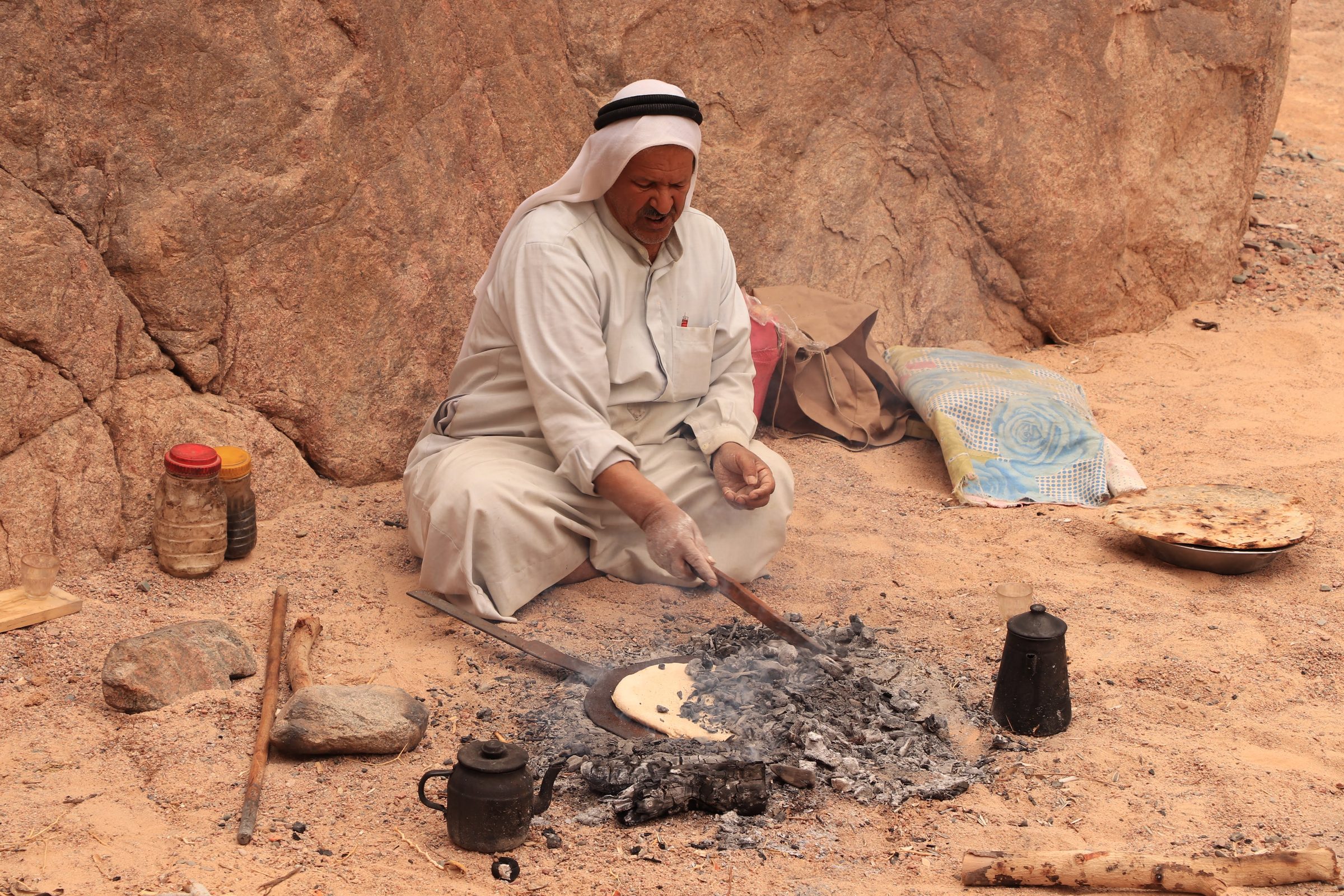 Our guide Suleiman baking the traditional Bedouin bread